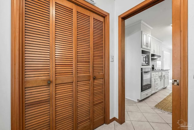 hallway with light tile patterned flooring