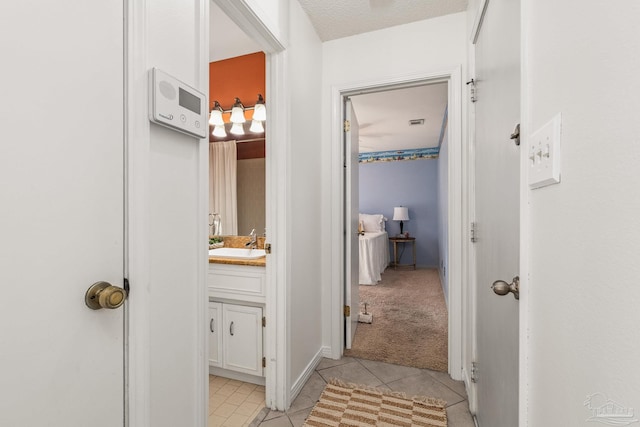 bathroom featuring tile patterned floors and vanity