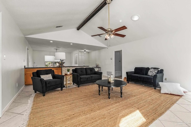 living room featuring light tile patterned floors, ceiling fan, lofted ceiling with beams, and sink