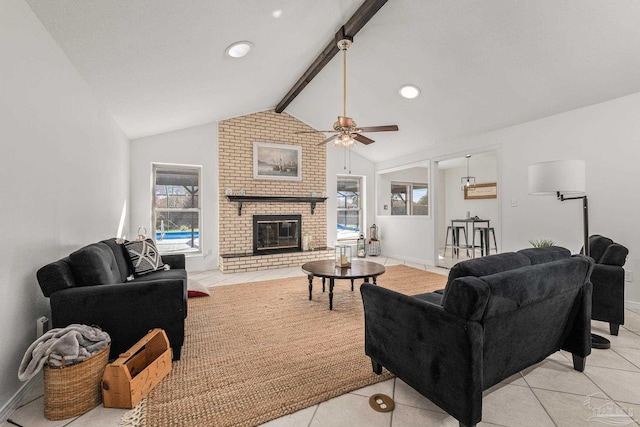 living room with a brick fireplace, plenty of natural light, vaulted ceiling with beams, and light tile patterned flooring