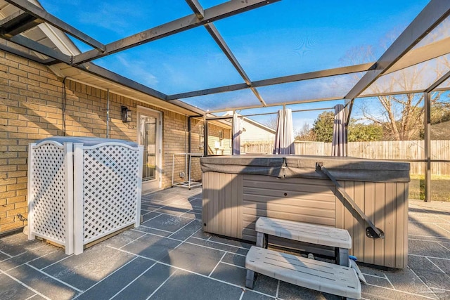 exterior space featuring a patio area and a hot tub