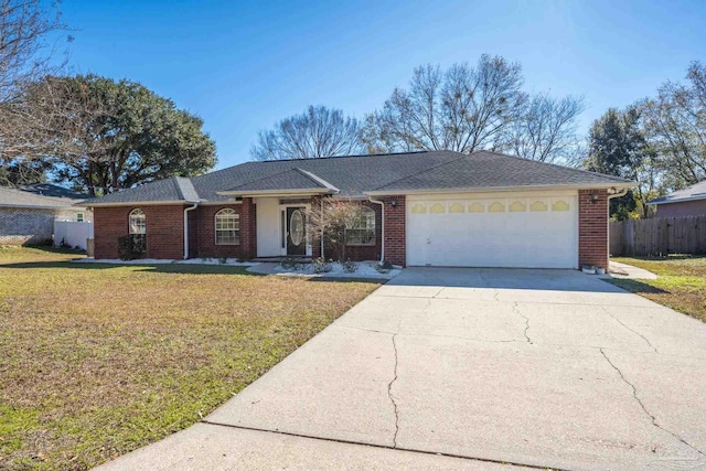 ranch-style house with a garage and a front lawn