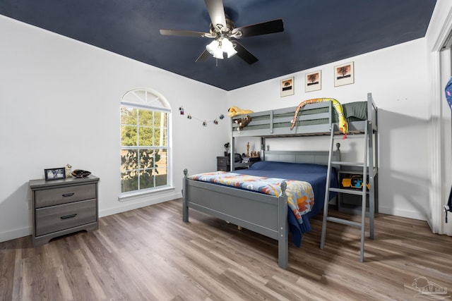 bedroom featuring wood-type flooring and ceiling fan