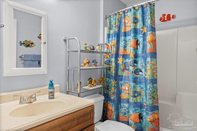 bathroom with vanity and toilet