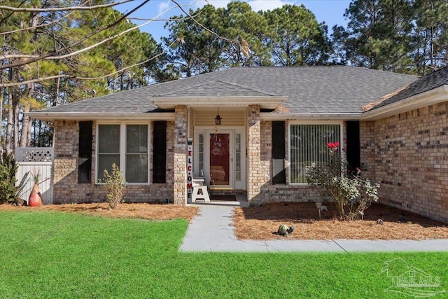 ranch-style house featuring a front lawn