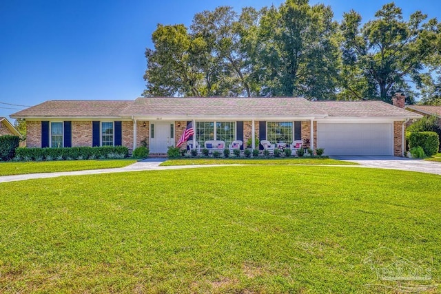 ranch-style home with a garage and a front lawn