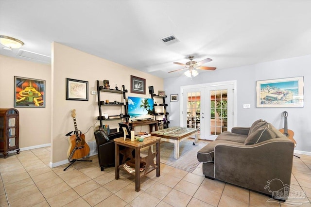 living room with light tile patterned flooring, ceiling fan, and french doors