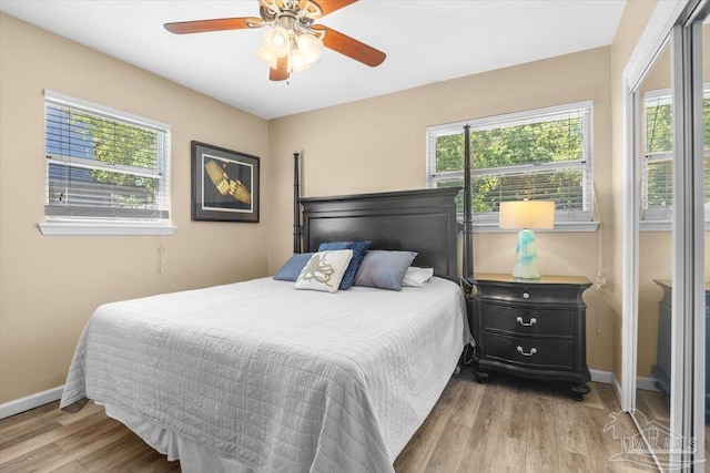 bedroom featuring wood-type flooring and ceiling fan