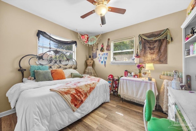 bedroom featuring ceiling fan and light hardwood / wood-style flooring