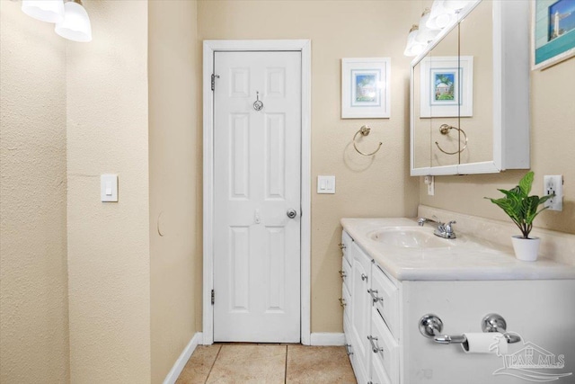 bathroom with vanity and tile patterned floors