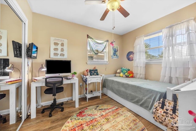 bedroom featuring wood-type flooring and ceiling fan