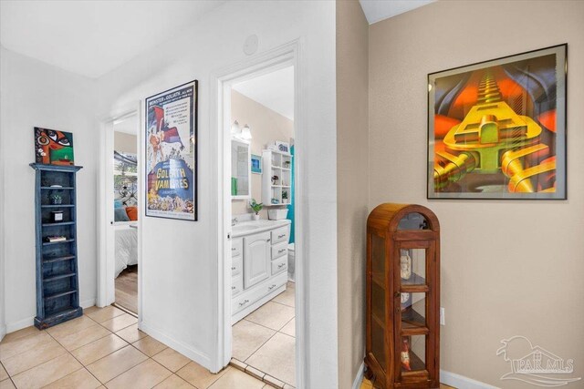 hall with light tile patterned flooring