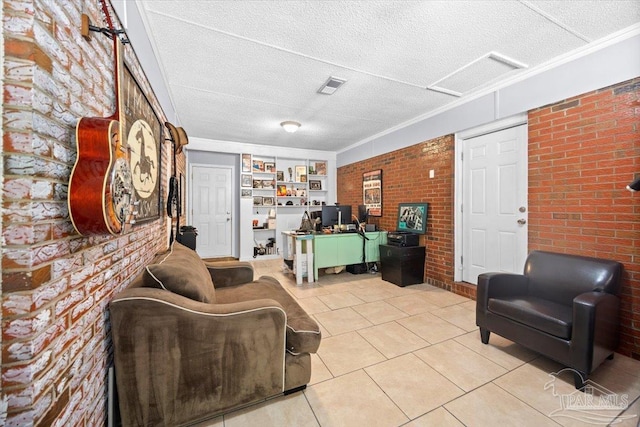 interior space featuring a textured ceiling, light tile patterned floors, crown molding, and brick wall