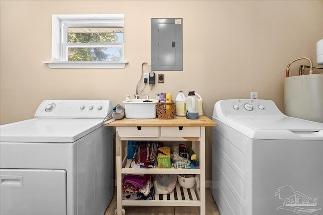 clothes washing area with water heater, electric panel, independent washer and dryer, and tile patterned flooring