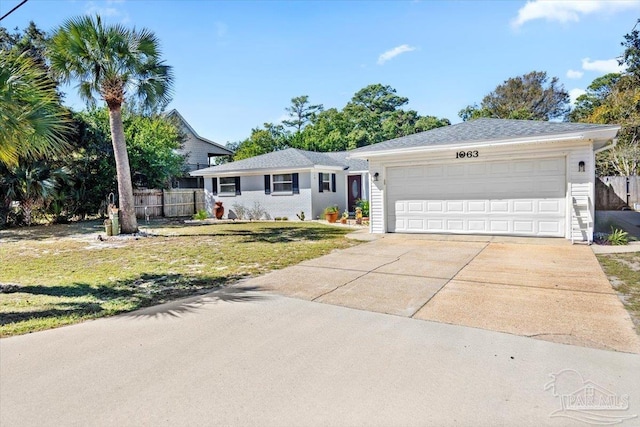 single story home featuring a garage and a front yard