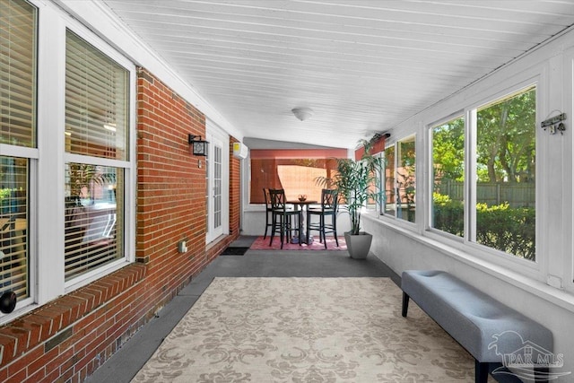 sunroom / solarium with vaulted ceiling