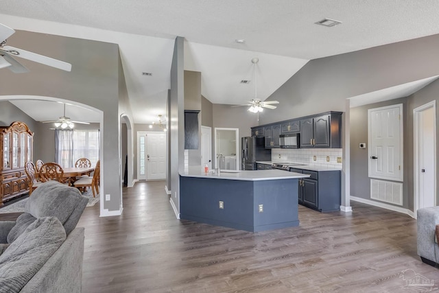 1096 Adrian Way, Milton, FL 32583 - kitchen with ceiling fan, open floor plan, arched walkways, a sink, and black microwave