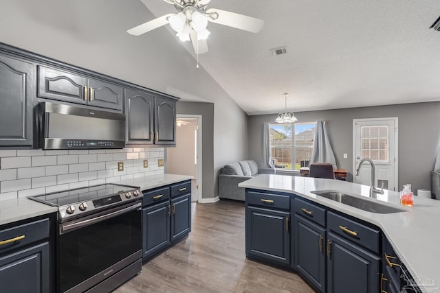 1096 Adrian Way, Milton, FL 32583 - kitchen featuring stainless steel electric stove, a sink, light countertops, and lofted ceiling
