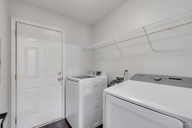 1096 Adrian Way, Milton, FL 32583 - washroom with washer and clothes dryer and dark wood-style flooring