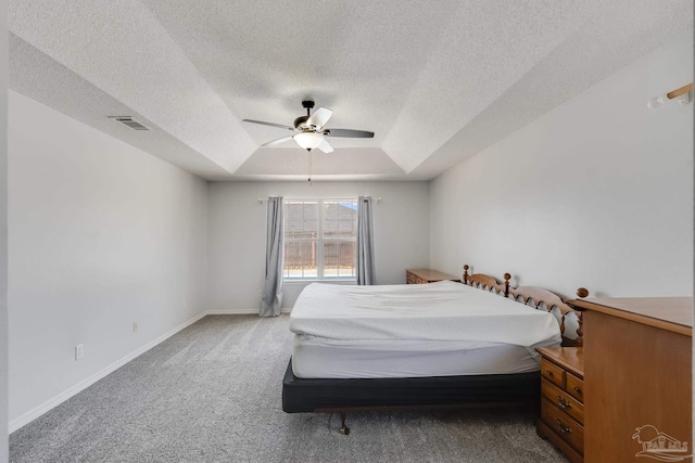 1096 Adrian Way, Milton, FL 32583 - carpeted bedroom with a tray ceiling, a textured ceiling, ceiling fan, and baseboards