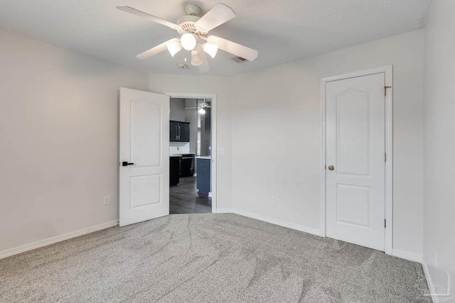 1096 Adrian Way, Milton, FL 32583 - spare room featuring carpet, a ceiling fan, and baseboards