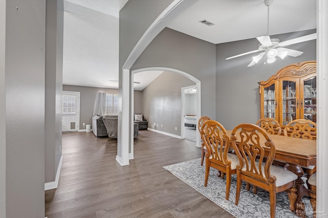 1096 Adrian Way, Milton, FL 32583 - dining room with arched walkways, ceiling fan, baseboards, and wood finished floors
