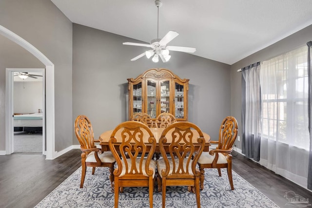 1096 Adrian Way, Milton, FL 32583 - dining area featuring a ceiling fan, vaulted ceiling, wood finished floors, arched walkways, and baseboards