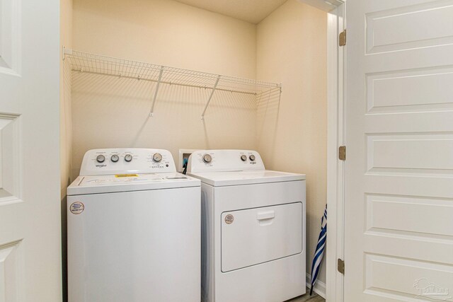 clothes washing area featuring washing machine and dryer