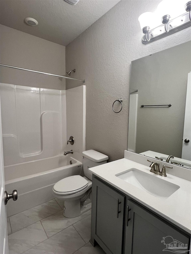 2305 Habersham Ln, Cantonment, FL 32533 - bathroom featuring a textured wall, marble look tile flooring, a textured ceiling, toilet, and vanity