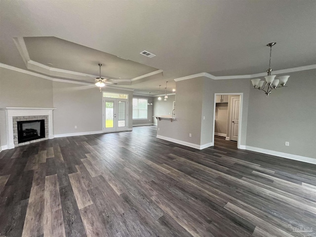 2305 Habersham Ln, Cantonment, FL 32533 - unfurnished living room featuring a raised ceiling, baseboards, ornamental molding, a chandelier, and dark wood finished floors