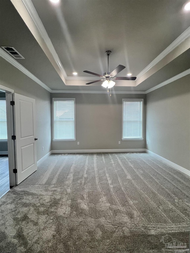 2305 Habersham Ln, Cantonment, FL 32533 - empty room with a tray ceiling, crown molding, carpet floors, a ceiling fan, and baseboards