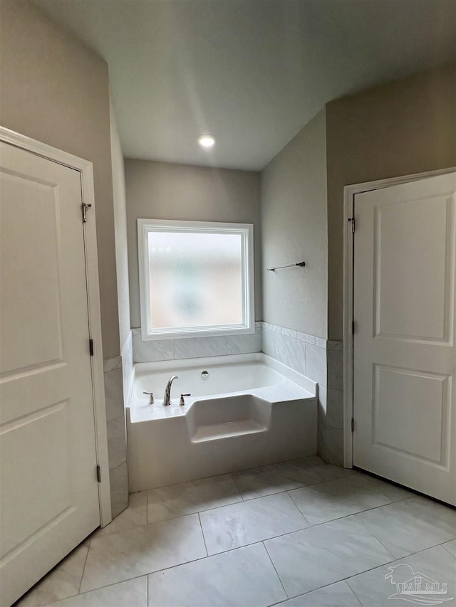 2305 Habersham Ln, Cantonment, FL 32533 - bathroom featuring a bath and tile patterned flooring