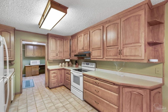 kitchen with light tile patterned flooring, white appliances, ornamental molding, and a textured ceiling