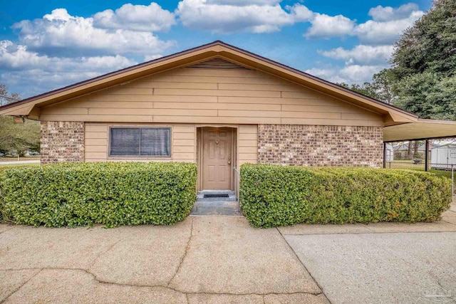 view of front of property with a carport