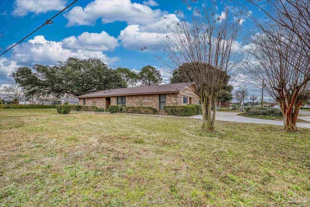 ranch-style house with a front lawn