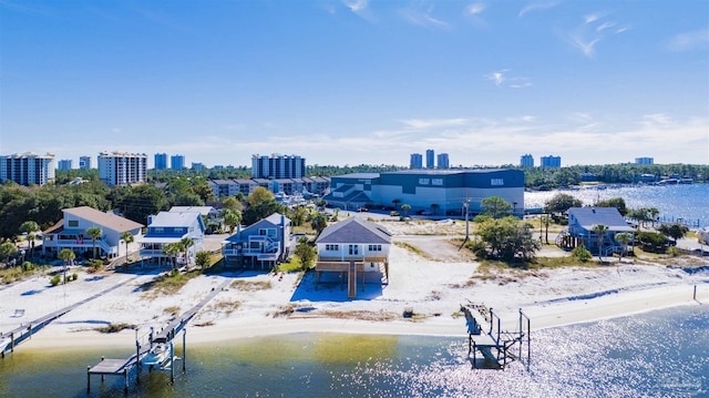 bird's eye view with a beach view and a water view