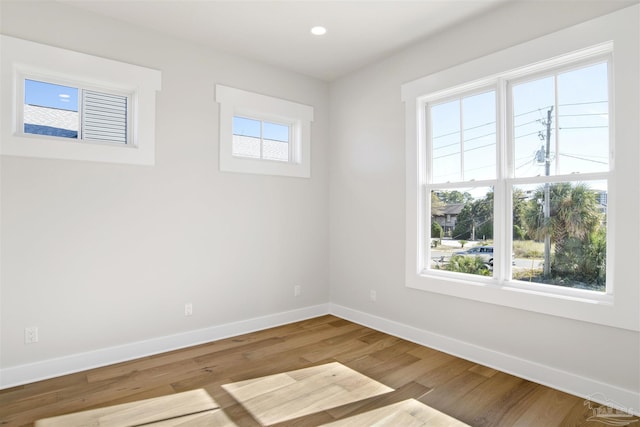 unfurnished room featuring hardwood / wood-style floors