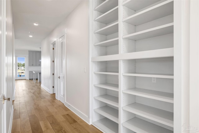 hallway featuring light hardwood / wood-style flooring