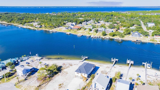 aerial view with a water view and a view of the beach