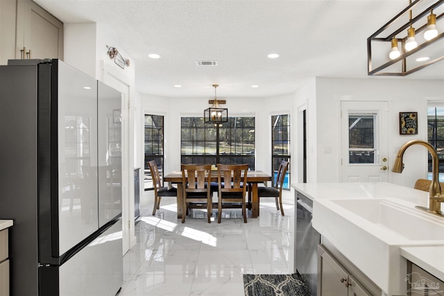 dining room featuring visible vents, marble finish floor, a textured ceiling, a chandelier, and recessed lighting