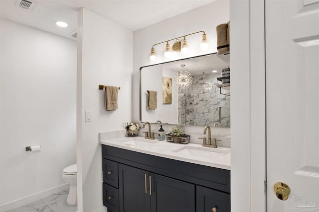 full bath with marble finish floor, a marble finish shower, a sink, and toilet