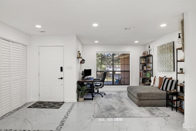 office space featuring baseboards, marble finish floor, visible vents, and recessed lighting