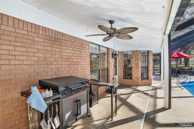 view of patio / terrace featuring ceiling fan, an outdoor pool, and area for grilling