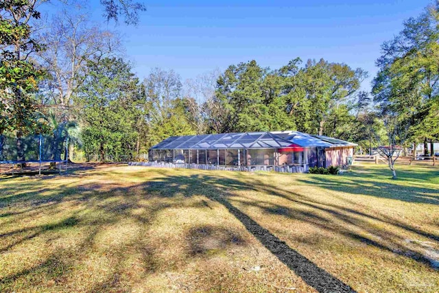 exterior space with a trampoline and a front yard