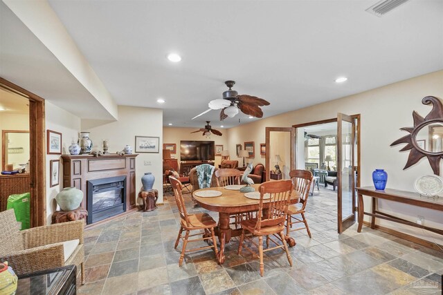 dining space featuring ceiling fan