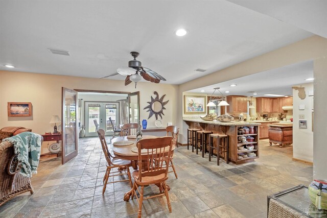 dining room featuring french doors and ceiling fan