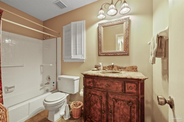 full bathroom featuring shower / bath combination, tile patterned flooring, vanity, a textured ceiling, and toilet