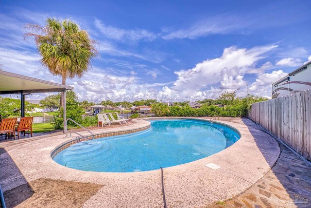 view of swimming pool featuring a patio