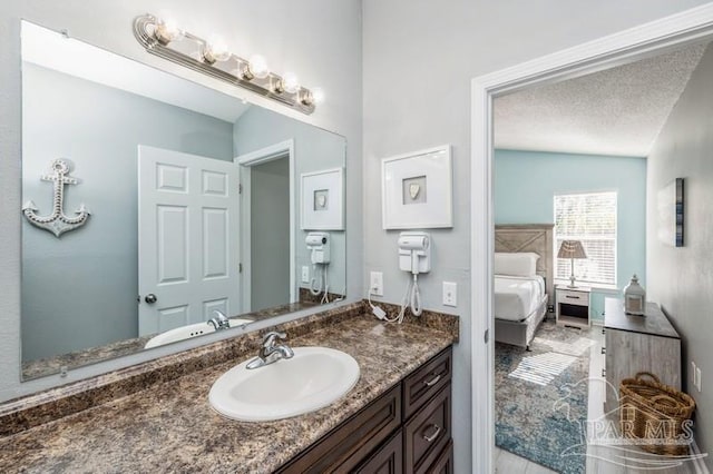 bathroom featuring vanity and a textured ceiling