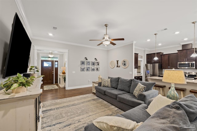 5622 Dunridge Dr, Pace, FL 32571 - living room with wood finished floors, ceiling fan, recessed lighting, and ornamental molding